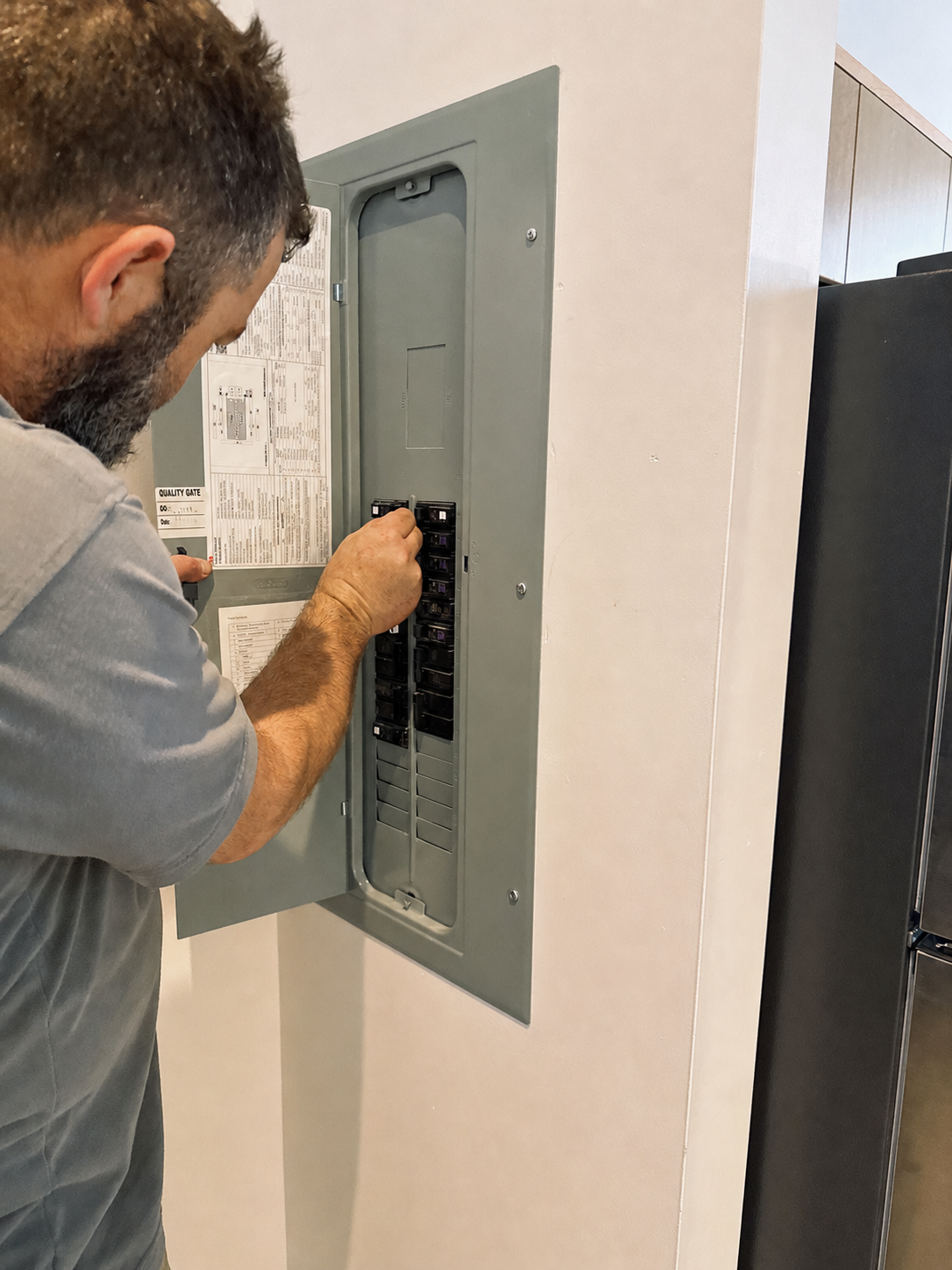 Electrician servicing an electrical panel in Roanoke, Virginia